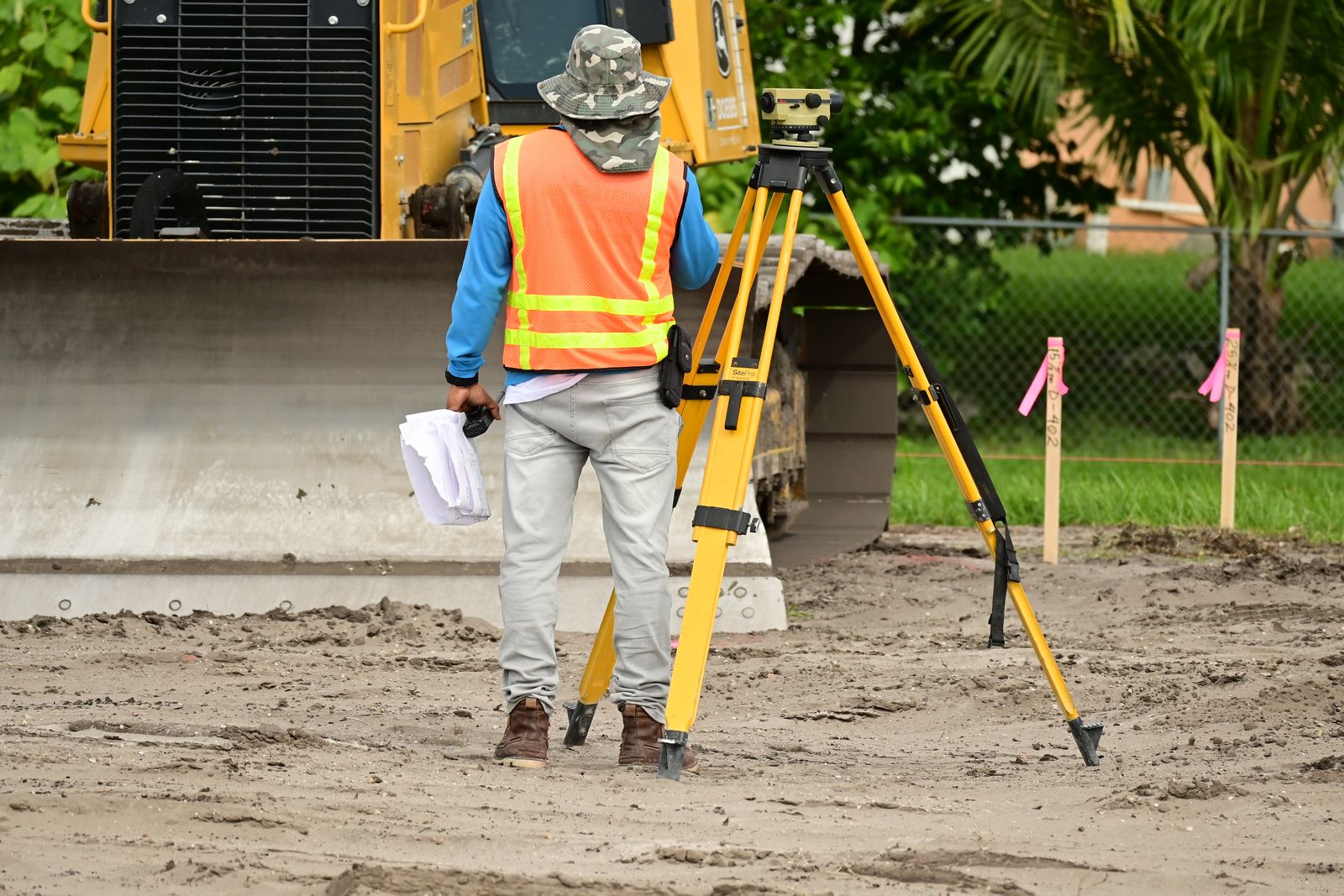 Survey team using field equipment to assess a potential site